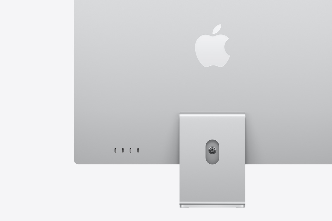 Vista posterior de una iMac color plata, que destaca los cuatro puertos USB-C