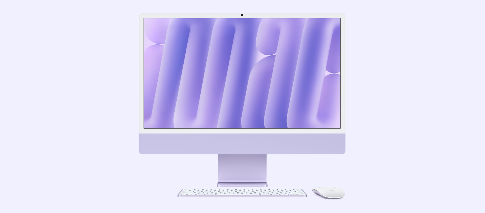 Vista frontal de una iMac morada con mouse y teclado a juego