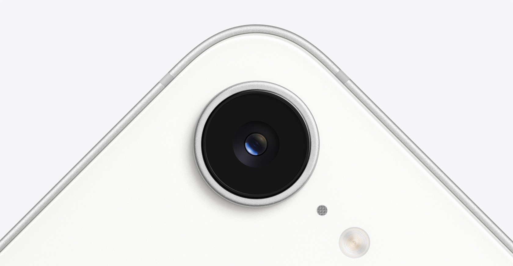 Camera lens on iPhone 16e in colour White.