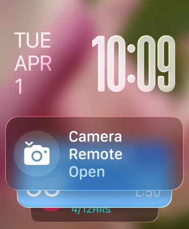 El widget Control de Cámara aparece en la parte inferior de la pantalla, con números translúcidos en la parte superior derecha y la fecha a la izquierda
