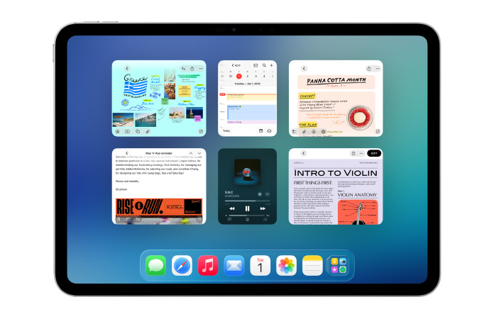 Un iPad, posición horizontal, la pantalla muestra varias apps como Calendario y Música acomodadas en un mosaico de seis ventanas dispuestas en dos filas de igual tamaño