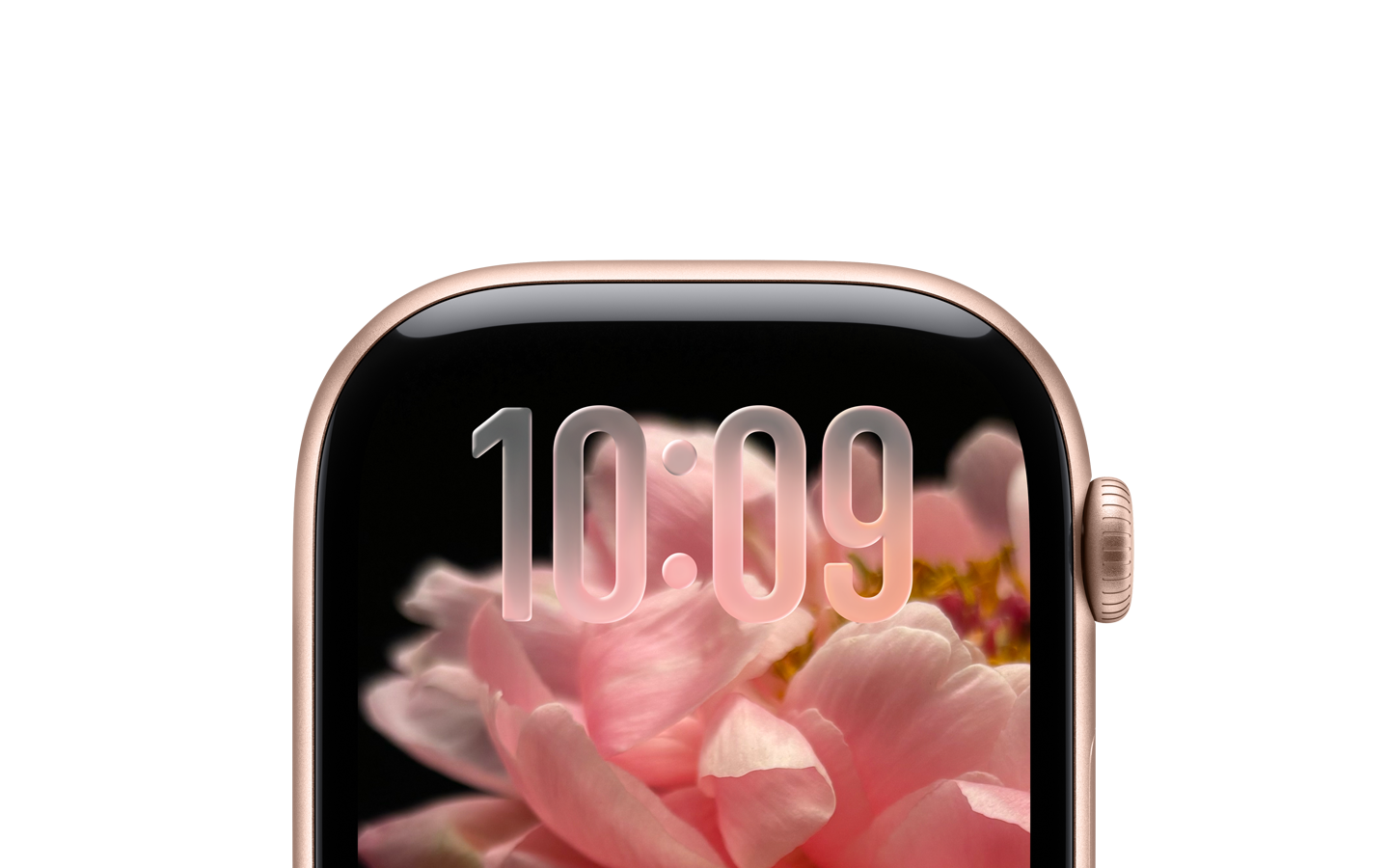 Un Apple Watch color oro rosa, sin correa, y sólo la parte superior de la carátula es visible, donde cerca del borde superior se aprecian números traslúcidos con el diseño con Liquid Glass